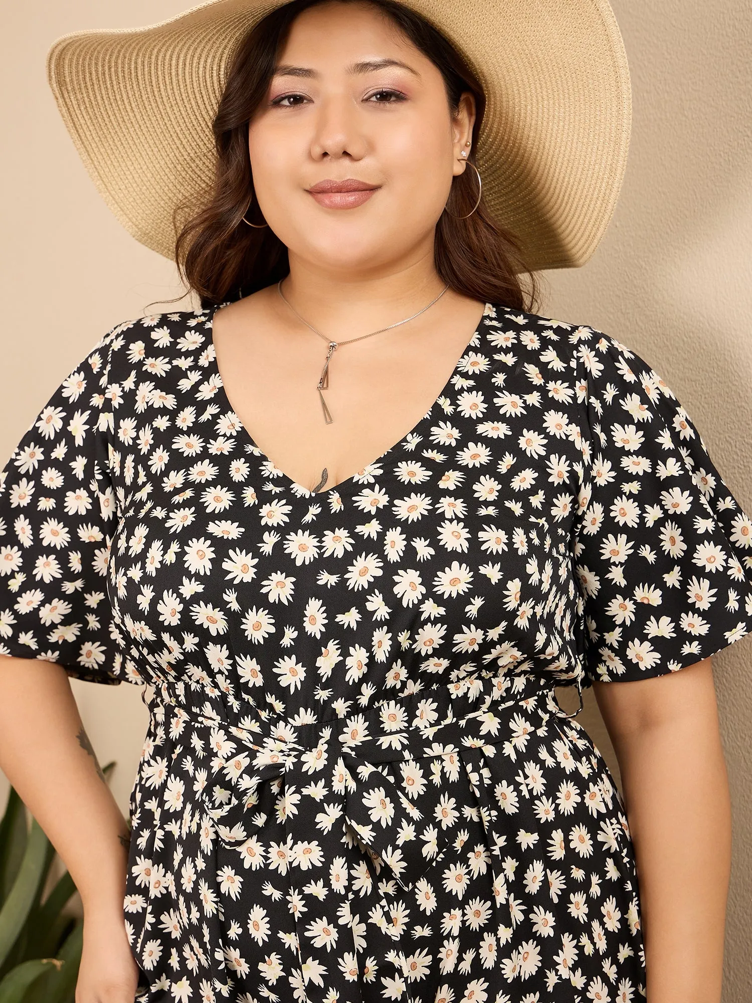 Berrylush Curve Women Black & White Floral Printed V-Neck Flared Sleeves Tie-Up Waist Back Keyhole Straight Hem Mini Jumpsuit